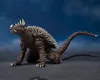 A Godzilla-like monster figure on a dark, textured surface with a dark blue background. Náhled obrázku produktu