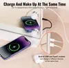 A vanity mirror with LED lights and charging ports, showing phones and earbuds being charged. Voir les images du produit