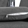 A close-up view of a dark gray cushion with a partially unzipped closure, revealing white material inside. Produktbild-Vorschau