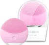 Two pink FOREO LUNA mini 2 facial cleansing devices are displayed against a white background. One device is in the foreground, and the other is behind it, partially enclosed in clear plastic packaging. Produktbild-Vorschau