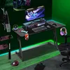 A gaming desk setup in a room with green ambient lighting. Produktbild-Vorschau