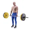 A man is holding a barbell with weights, preparing for a deadlift. Produktbild-Vorschau