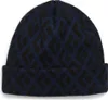Dunkelblaue Repeat Beanie von Black Diamond mit geometrischem Muster.