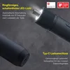 Close-up marketing image of a dark gray electric screwdriver with its LED light on, showing a USB-C charging port on another part of the product. Podgląd zdjęcia produktu