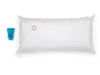 A white pillow and a blue cap on a white background. Podgląd zdjęcia produktu