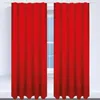 Two red curtains are drawn, partially covering a window with a light blue sky visible through the panes. Produktbild-Vorschau