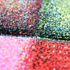A close-up, abstract view of a colorful, textured rug with a checkered pattern. Náhled obrázku produktu