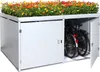 A white metal bicycle garage with a planter box filled with colorful flowers on top. One door is open, revealing two bicycles inside. Anteprima dell’immagine prodotto