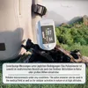 A pulse oximeter is placed on a piece of wood in an outdoor setting, with a backpack in the background and mountains and a plane in the distance. Produktbild-Vorschau