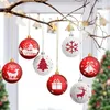 Christmas ornaments hanging from a tree branch. Náhled obrázku produktu