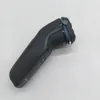 A black electric shaver with blue accents is shown against a white background. Podgląd zdjęcia produktu