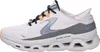 A side view of a single white Skechers sneaker with gray and orange accents. Voir les images du produit