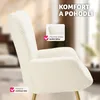 Close-up of a plush, white armchair with gold legs, featuring marketing overlays highlighting comfort and material. Náhled obrázku produktu