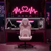 A gaming setup with a pink gaming chair, desk, computer, and neon heart-shaped light. Náhľad obrázku produktu
