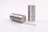Two cylindrical metal finials and an Allen wrench on a white background. Produktbild-Vorschau