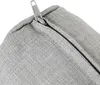 A close-up view of a grey zipper on a fabric cushion. Produktbild-Vorschau