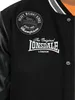 Close-up of a black Lonsdale college jacket with embroidered logos and text. Produktbild-Vorschau