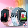 Two children's smartwatches, one pink and one blue, are displayed against a colorful, abstract background. Náhled obrázku produktu