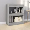A grey bookshelf with books and decorative boxes on it, placed on a light wooden floor. Voir les images du produit