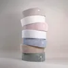 A stack of colorful, round cushions or bolsters, possibly for a ball pit or play area, against a plain background. Produktbild-Vorschau