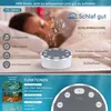 A person sleeping in bed with a sound machine next to them, surrounded by marketing text and graphics. Produktbild-Vorschau