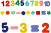 A collection of colorful wooden numbers and shapes, along with a simple equation. Produktbild-Vorschau