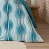 Close-up of bedding with a wave pattern. Produktbild-Vorschau
