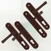 Four door handles with plates are arranged diagonally on a white background. Anteprima dell’immagine prodotto