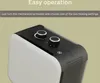 A close-up view of the top and side of a white and black electric heater, with text overlays describing its operation. Voir les images du produit