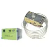 A thermostat with a coiled wire and its packaging. Produktbild-Vorschau
