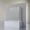 A modern bathroom setting with a bathtub and a glass shower screen. Produktbild-Vorschau