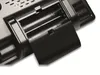 A close-up view of the back of a black electronic device, showing an open battery compartment with two AA batteries inserted. Produktbild-Vorschau