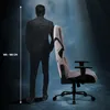A person stands next to a gaming chair, with a height indicator on the left. Náhľad obrázku produktu