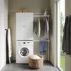A laundry room scene with a washing machine, storage cabinet, and laundry accessories. Produktbild-Vorschau