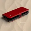 A red leather phone case with a magnetic closure and a durable silicone frame is shown on a textured background. Produktbild-Vorschau