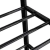 Close-up of a black metal shoe rack. Produktbild-Vorschau