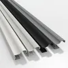 Four different colored profiles of a sliding door wardrobe are shown in a studio setting. Produktbild-Vorschau