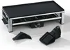 A raclette grill with accessories on a white background. Produktbild-Vorschau