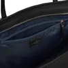 Close-up view of the interior of a black leather tote bag, showing a zippered pocket and a brand logo. Produktbild-Vorschau