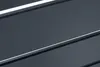 A close-up abstract view of a dark gray surface with thin white lines running diagonally across it. Produktbild-Vorschau