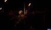 A dark, eerie scene with animatronic figures on a carousel. Produktbild-Vorschau