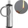 A close-up of a keychain lighter and a separate inset showing the lighter in use. Náhled obrázku produktu