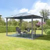 A garden gazebo with seating is set up on a lawn with trees and bushes in the background. Podgląd zdjęcia produktu