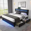 A modern bedroom with a black upholstered bed frame featuring LED lighting and storage drawers, set against a large window with curtains. Náhľad obrázku produktu