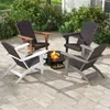 Four Adirondack chairs arranged around a fire pit on a paved patio. Produktbild-Vorschau