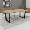 A dining room scene with a wooden table and chairs. Produktbild-Vorschau