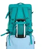 A teal backpack is placed on top of a light blue suitcase, with the backpack's straps visible and resting on the suitcase handle. Podgląd zdjęcia produktu