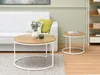 A living room scene with a white couch, two round coffee tables, and a bookshelf. Náhľad obrázku produktu