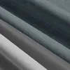 A close-up view of folded fabric, showing different shades of gray and anthracite. Produktbild-Vorschau