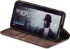 A smartphone in a brown flip case is displayed on a white background. The phone screen shows a movie poster for 'The Inspector'. Produktbild-Vorschau
